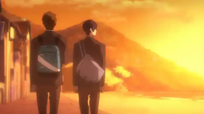 Two schoolboys with shoulder bags walk home beneath an orange evening sky.