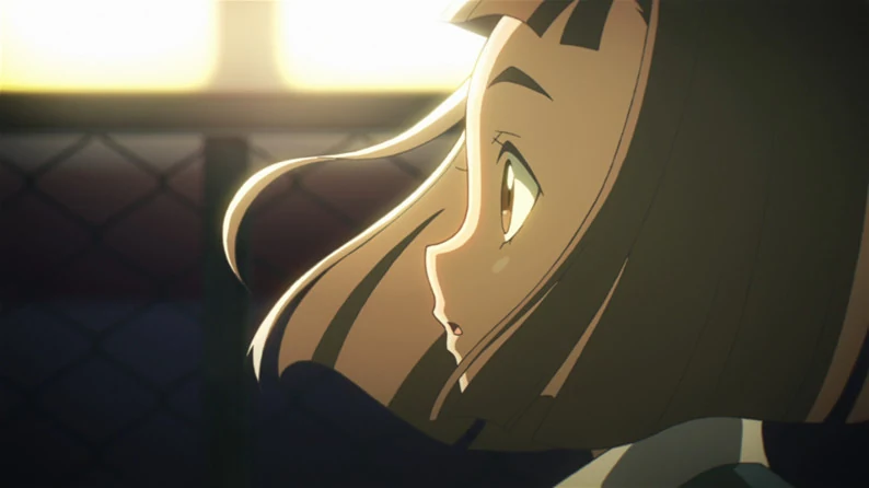 Mari looks up beside a brightly lit window.