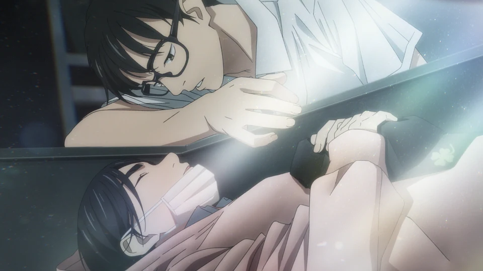 Ganta leans over the edge of a locker where Isaki lies, with light falling across them.
