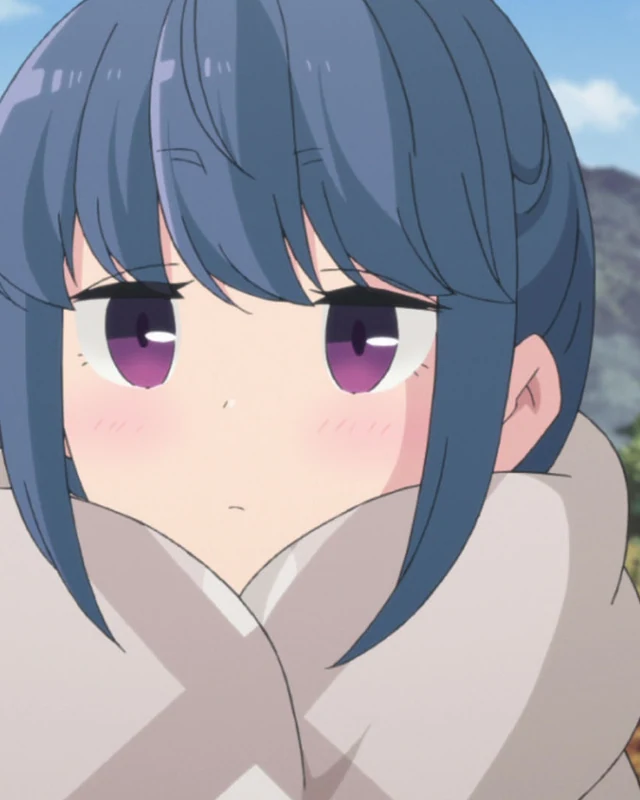 Rin looks ahead from inside the hood of her winter coat.
