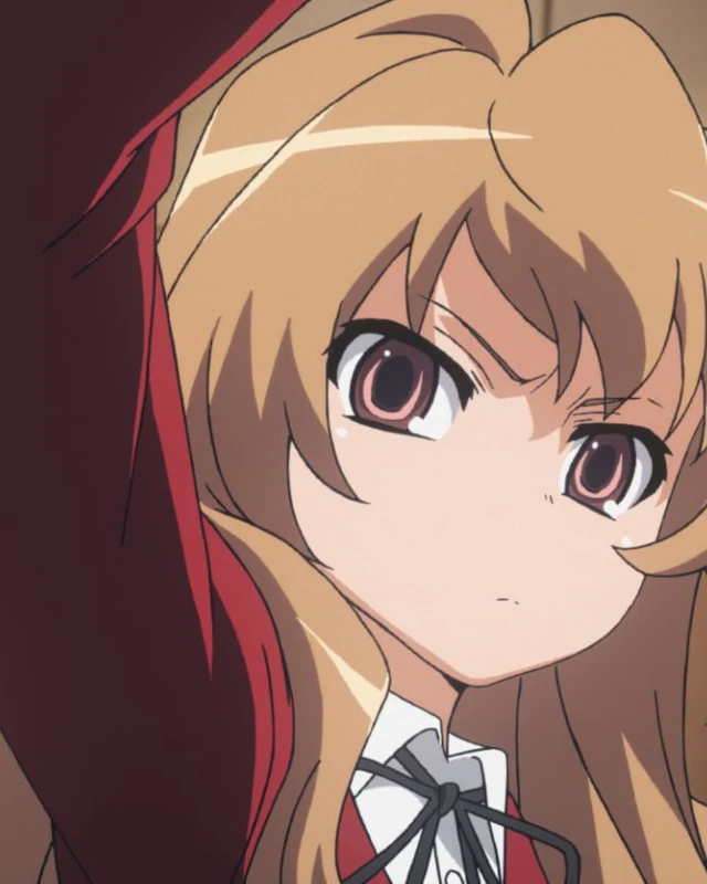 Taiga raises an arm, her long hair framing her face.