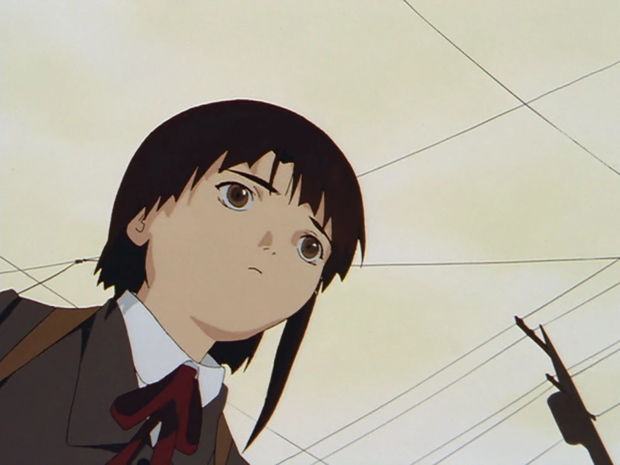 Lain looks upward beneath a pale sky crossed by cables and a utility pole.