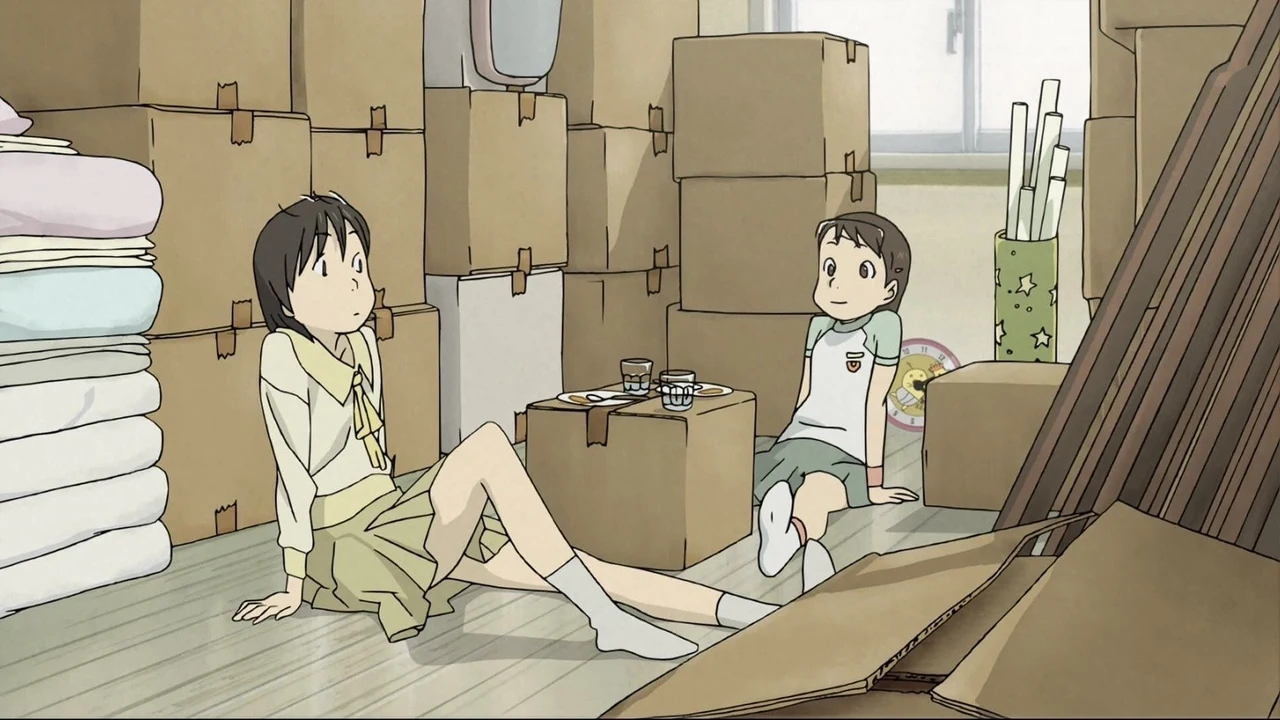 Yasako and a younger child sit among piled boxes and stored bedding in a cramped room.