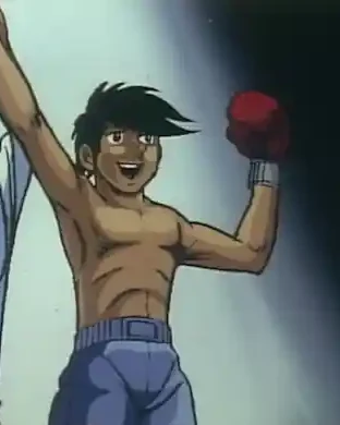 Joe holds his arms up, with a red boxing glove visible beside his head.
