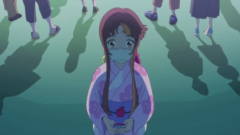 Smile wears a pink yukata and a white mask, holding her phone as she looks up among a crowd.