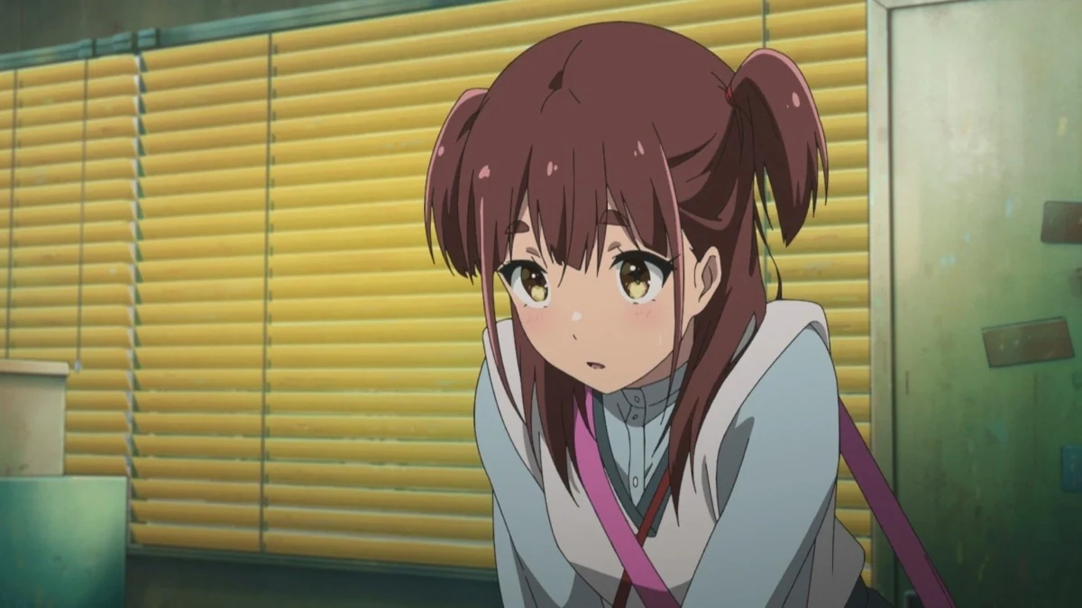 A brown-haired young woman with a pink shoulder strap leans forward in front of yellow window blinds.