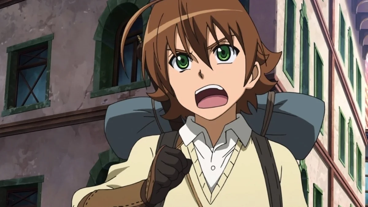 A brown-haired young man with a travelling pack speaks excitedly in a city street.