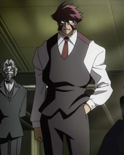 A tall red-haired man in glasses and a dark waistcoat stands beside a formally dressed older figure.