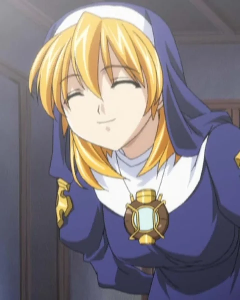 A smiling blonde young nun leans forward in a blue habit and white collar.