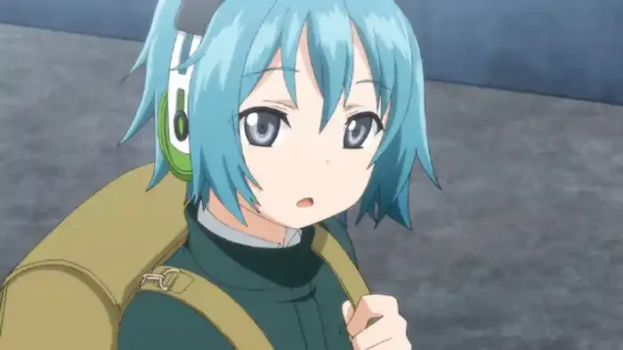 Blue-haired Naoto wears large green headphones and carries a pack over one shoulder.