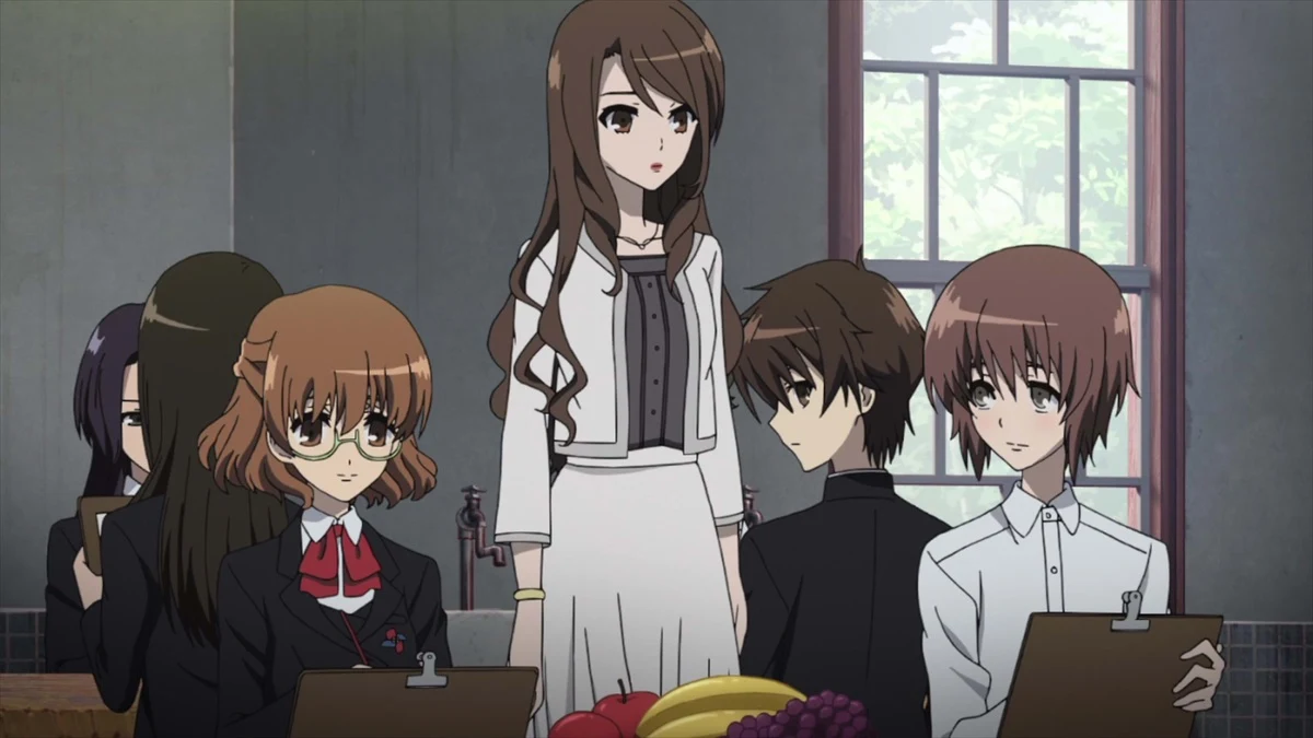 School pupils gather around a woman standing beside a window, with drawing boards and fruit in front of them.