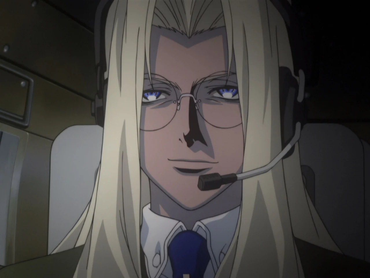 Integra looks ahead through her glasses while wearing a headset.