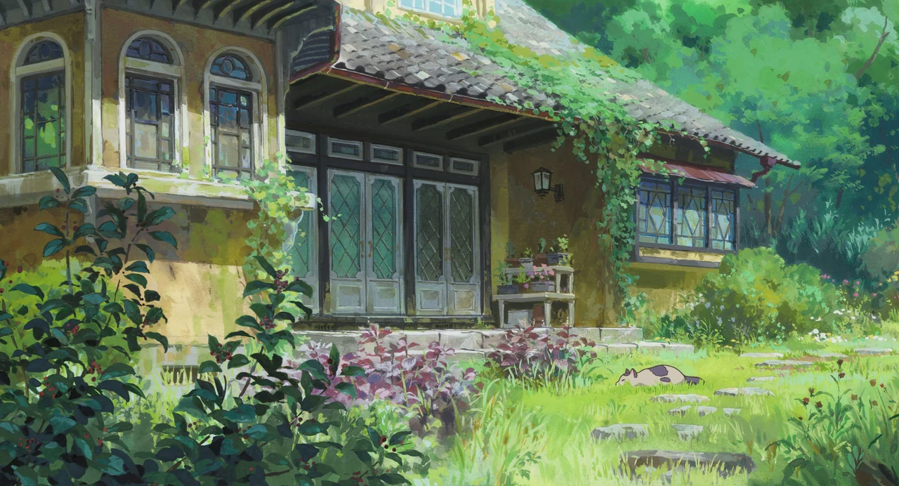 A timber house is surrounded by dense green foliage.