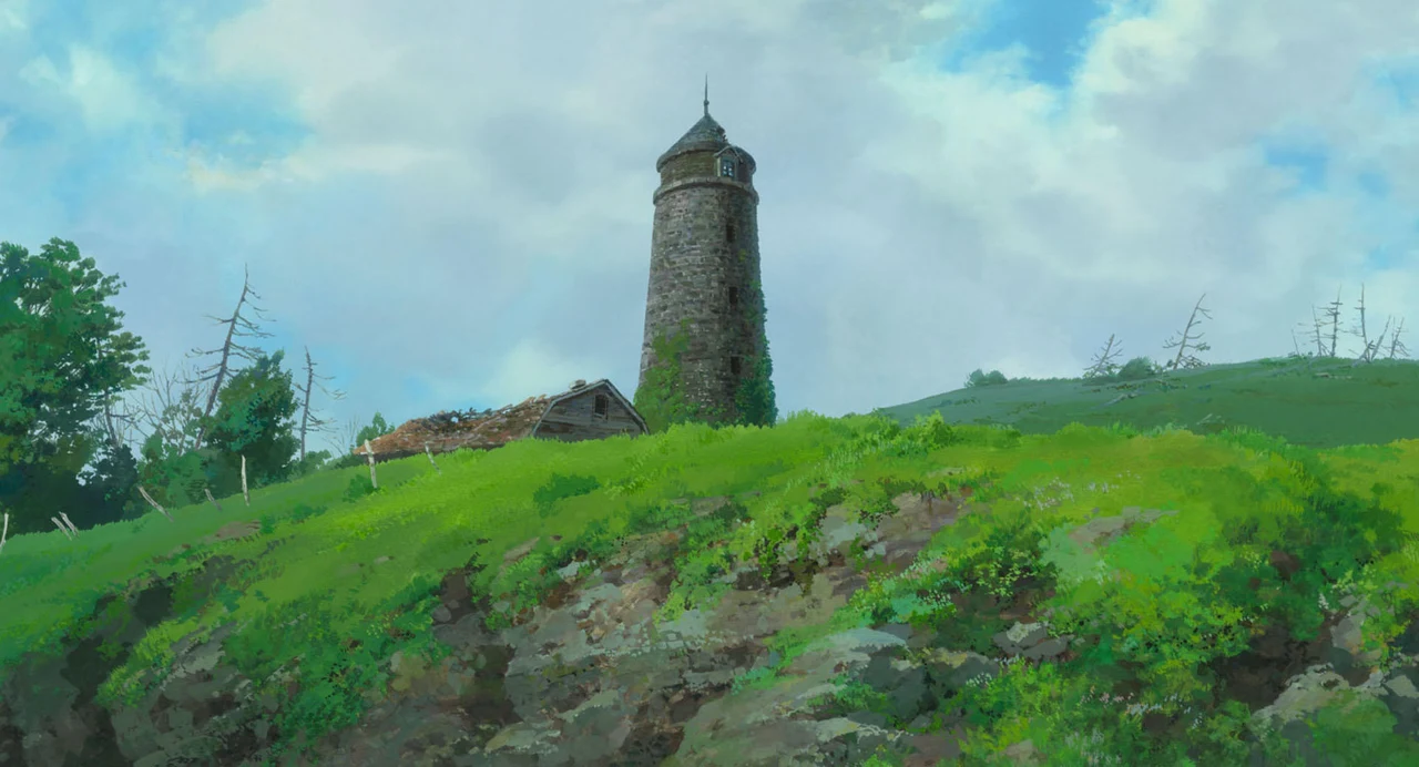 A lone stone tower stands on a grassy rise beneath clouds.