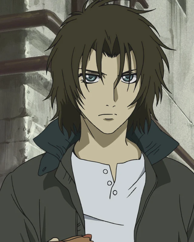 A dark-haired young man stands beside a stained stone wall.