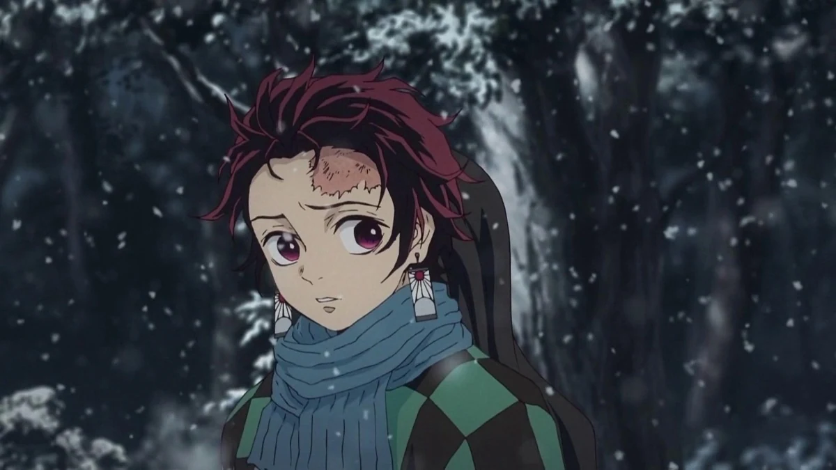 Tanjiro, wearing a blue scarf, stands in a snowy forest.