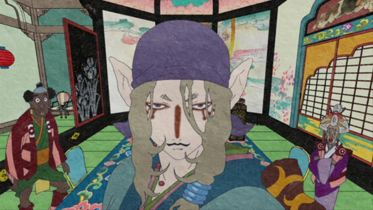 The Medicine Seller stands in a vividly patterned room with two people behind him.