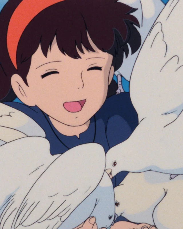 Sheeta smiles among white doves.