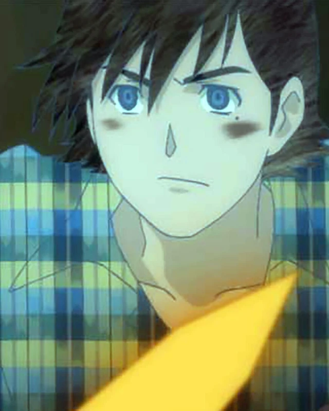 A blue-eyed young man looks ahead against patterned clothing.