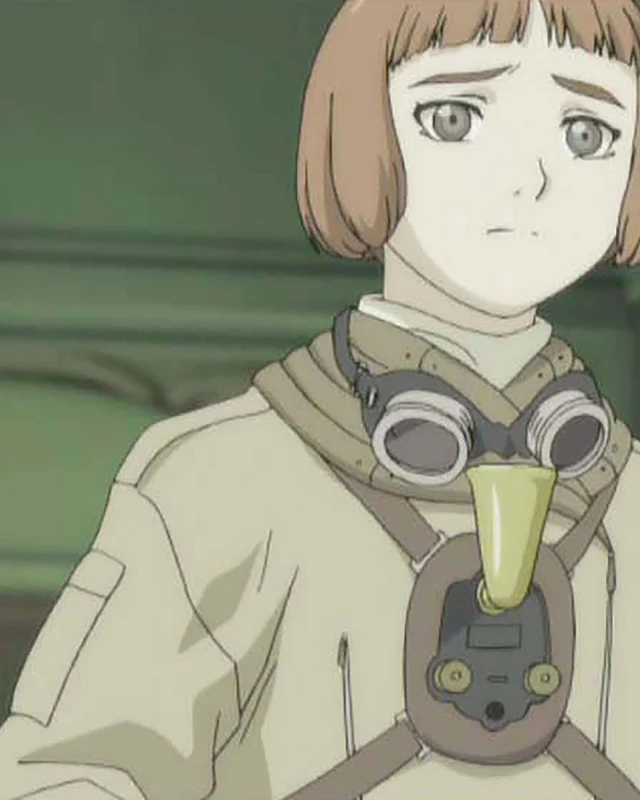 Lavie wears flying goggles around her neck in a green interior.