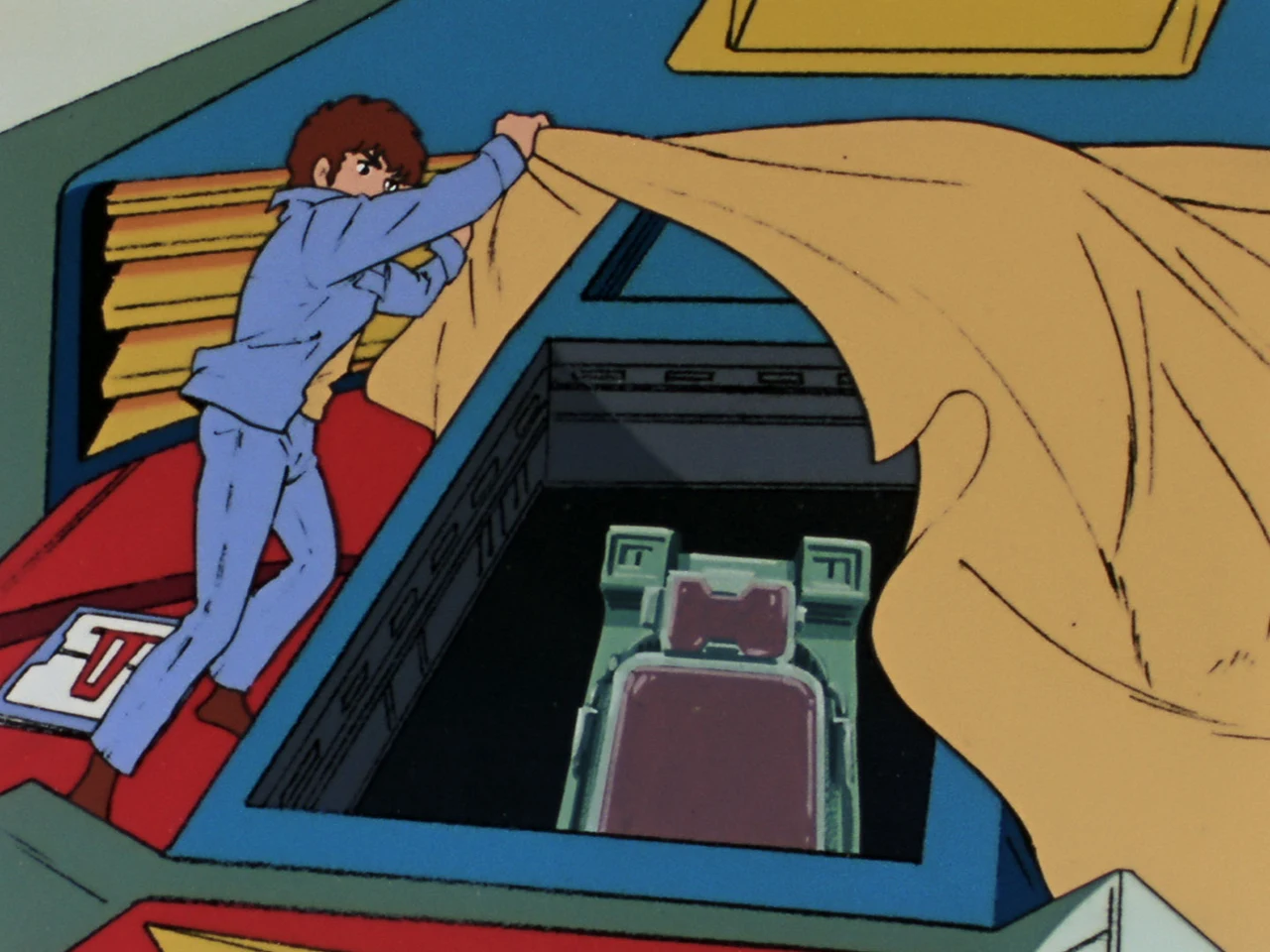Amuro pulls back a covering over the Gundam’s open cockpit.