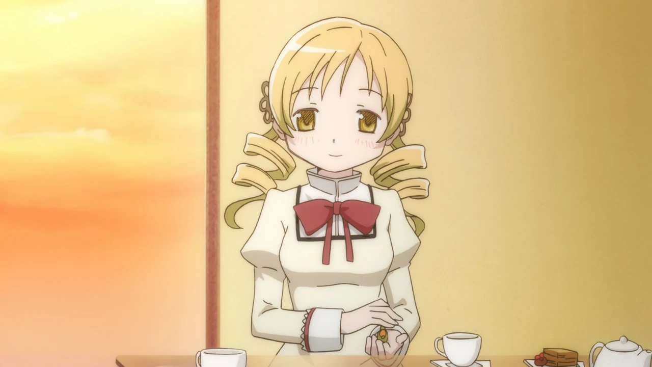 Mami sits at a table set with cups and plates in a softly lit room.