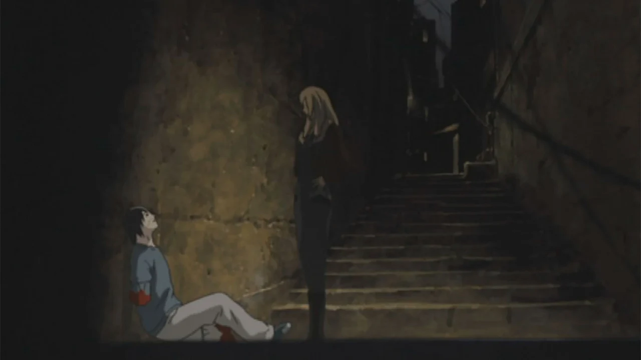 A wounded figure sits beside a stone staircase while another person stands nearby.