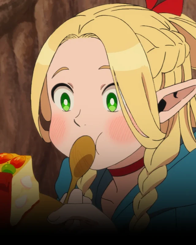 Marcille holds a wooden spoon near her mouth.