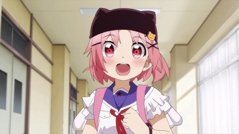 A pink-haired girl wearing a dark cat-eared hat stands in a school corridor.