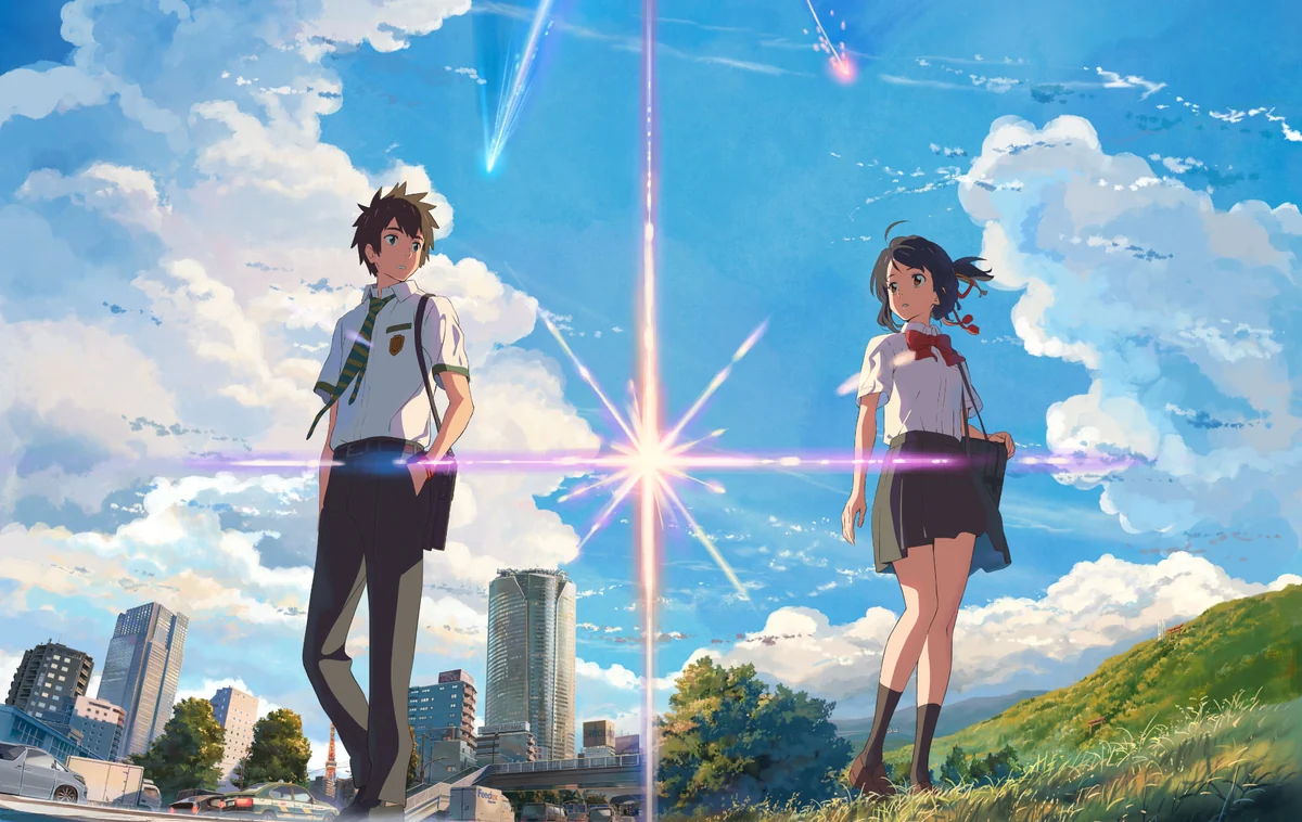 Taki stands above Tokyo while Mitsuha stands above a rural landscape in the paired Your Name artwork.