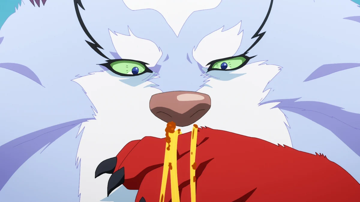 Fel looks down at long noodles and sauce spilling from a red bowl beneath his muzzle.