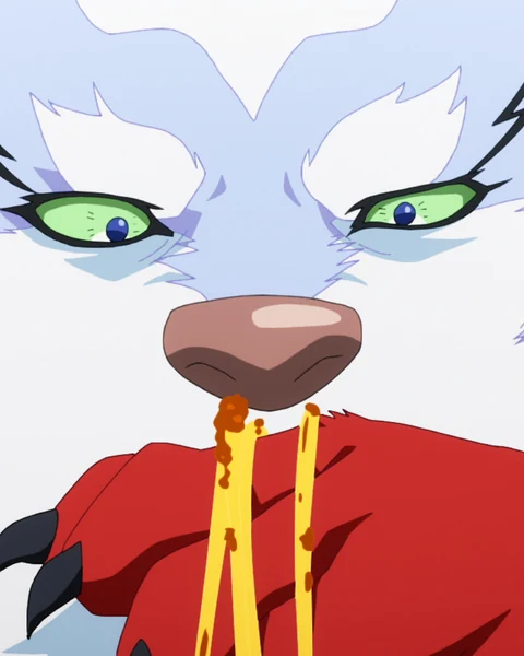 Fel’s green eyes look down at noodles hanging from a red bowl beneath his muzzle.