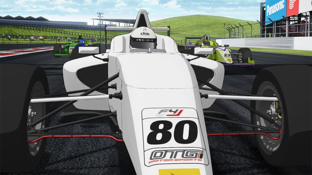 Komaki Motors' white number 80 F4 car leads two other cars at the circuit.