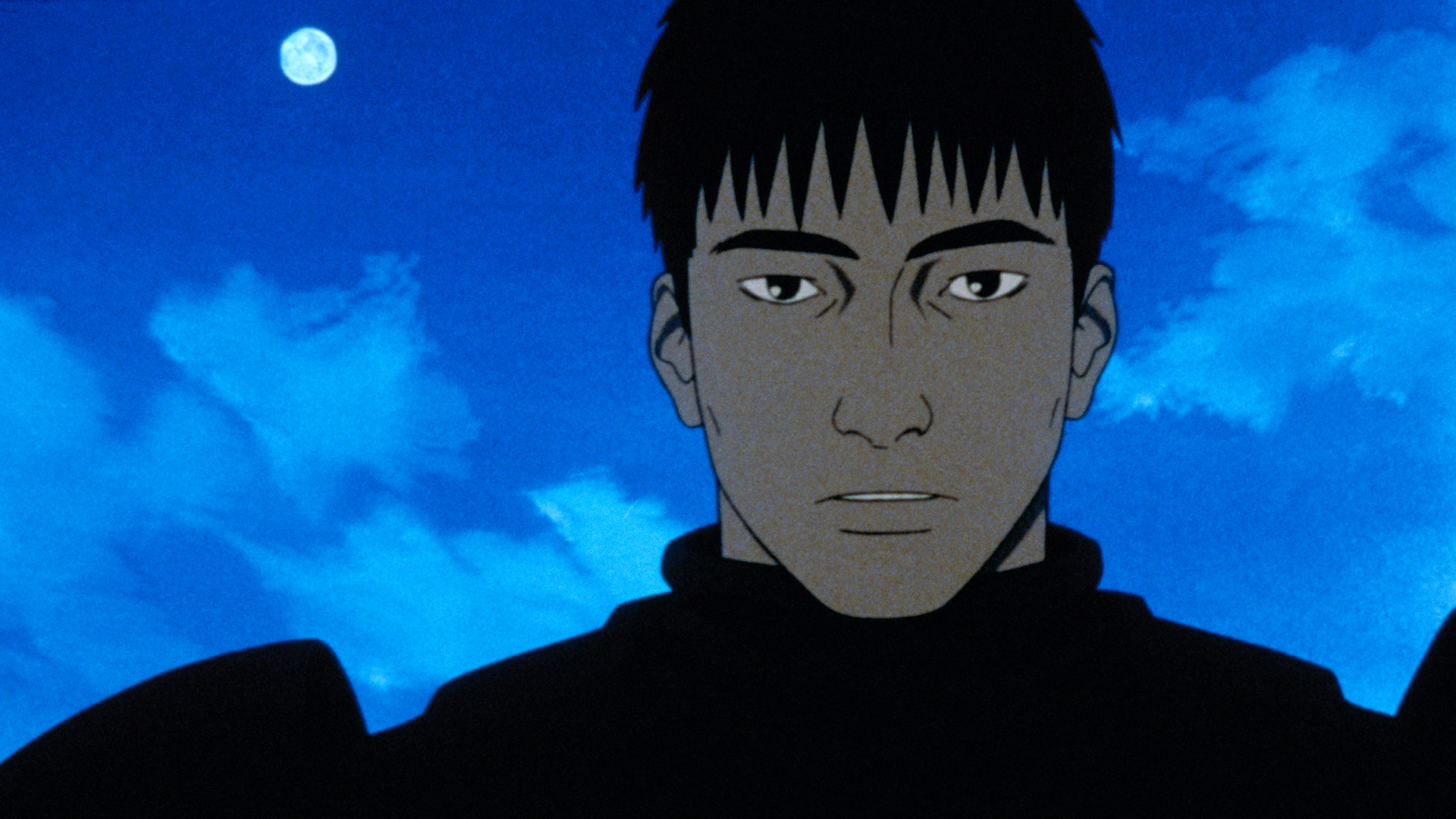Kazuki Fuse stands beneath a blue night sky.