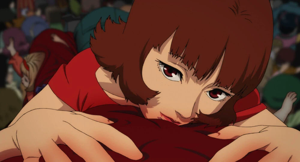 Paprika leans forward, looking toward the viewer.