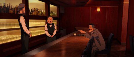 A seated man gestures across a wooden bar towards two attendants, with illuminated bottles behind them.