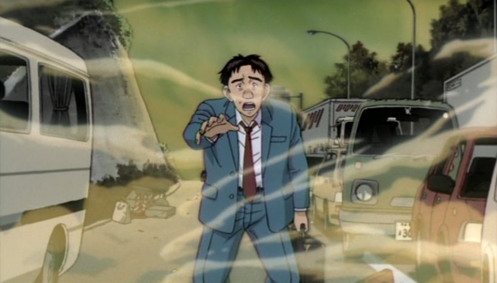 A man in a blue suit looks startled as pale gas curls around vehicles on a city road.