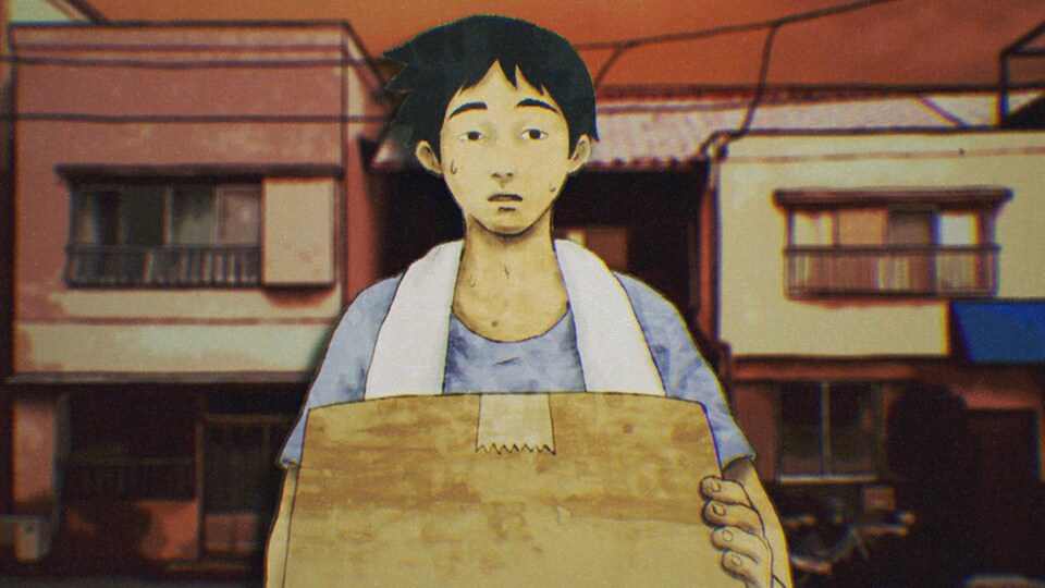A young man carries a box between apartment buildings.