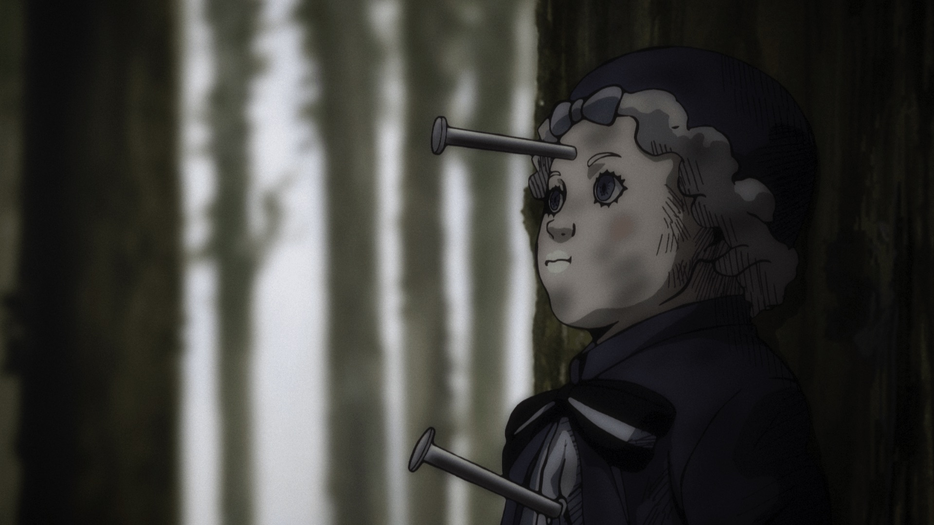 A doll in a dark hat stands among trees with long nails protruding from its forehead and chest.