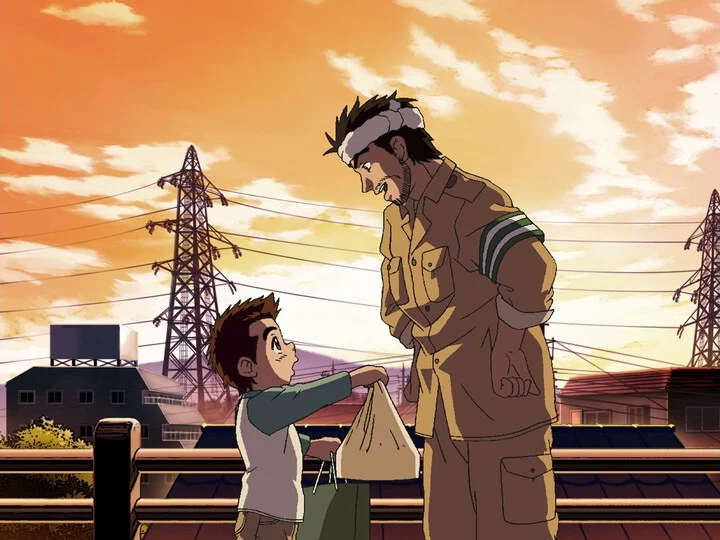 Young Capeta offers a shopping bag to his father beneath an orange evening sky.