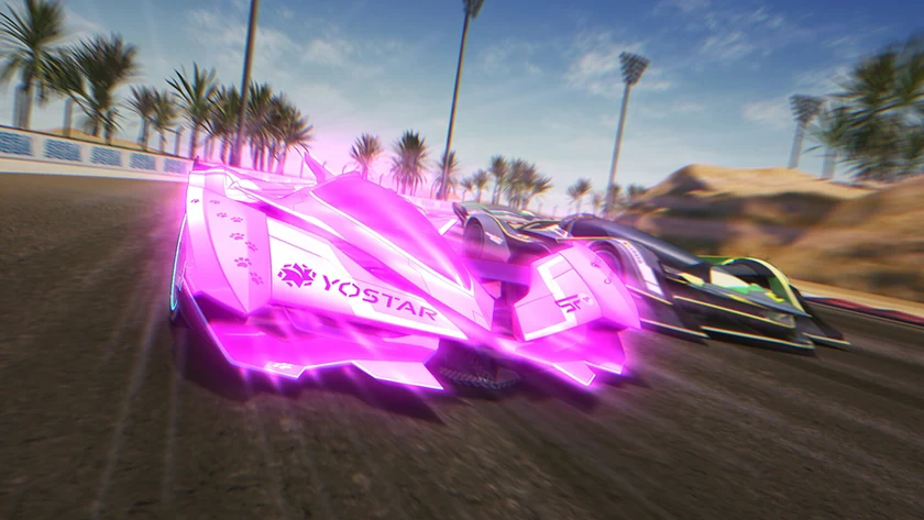 A bright pink racing car runs beside a green-and-black rival on a palm-lined circuit.