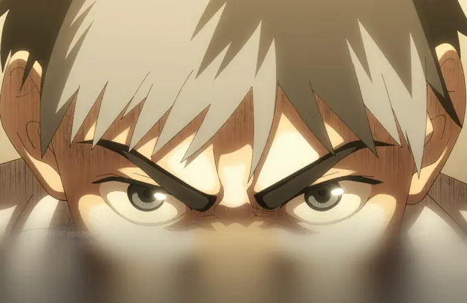 A young man’s narrowed eyes fill the upper frame above a blurred foreground.