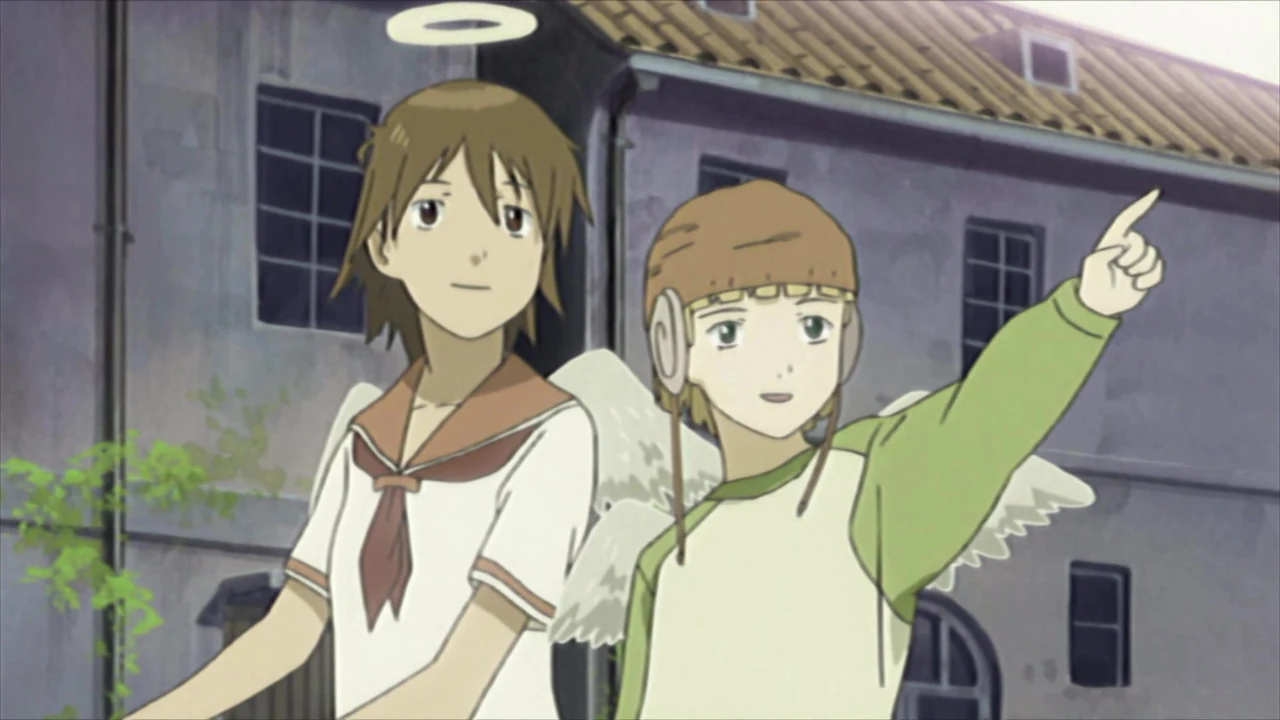 Rakka stands beside Kuu, who points into the distance outside a weathered building.