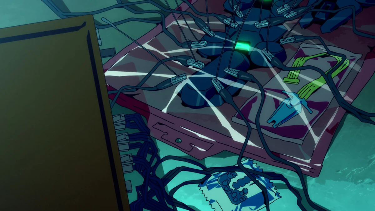 A segmented cybernetic implant lies in clear packaging among wires and connectors.