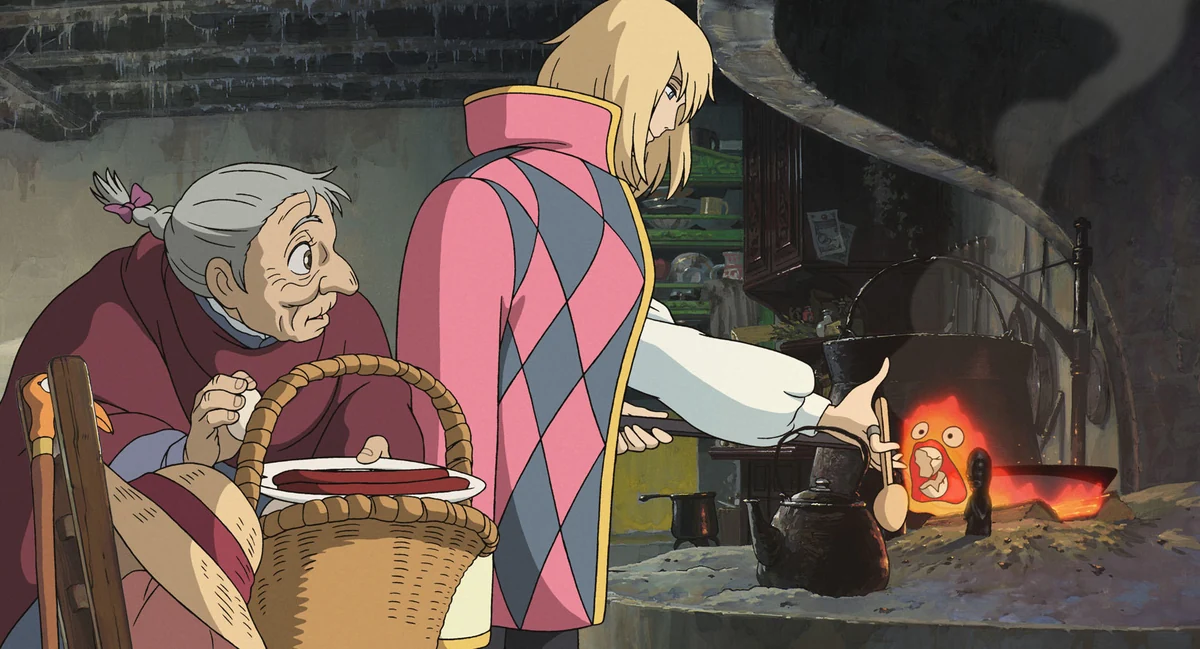 Sophie watches Howl cook over Calcifer, the fire demon in the castle hearth.