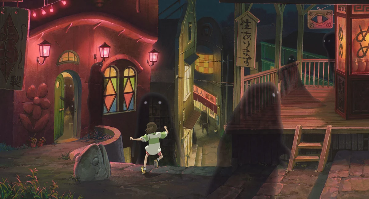 Chihiro runs between brightly lit buildings and shadowy spirits at night.